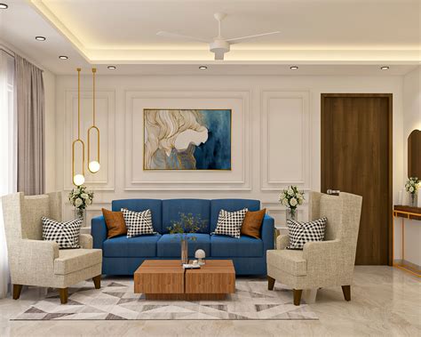 Living Room Design With Blue Sofa And Beige Accent Chairs | Livspace