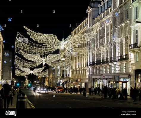 Flying angel Christmas lights at night in Regent Street, the West End ...