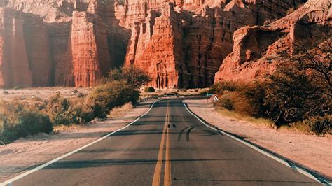Download wallpaper 1366x768 road, asphalt, mountains, rocks, landscape ...