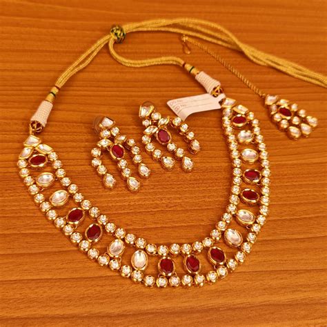 MULTI LAYERED RUBY STONE STUUDED GOLD LOOK KUNDAN POLKI SET – Sanvi Jewels