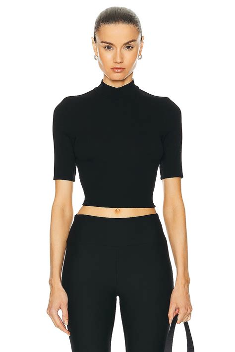 Enza Costa Silk Rib Cropped Half Sleeve Mock Neck Top in Black | FWRD
