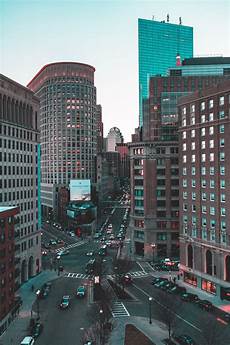 City Building Image by City Building During Daytime Photo Free Intersection City Building Image