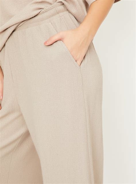 Buy Women Textured Wide Leg Trousers Online at just Rs. 699.0 ...