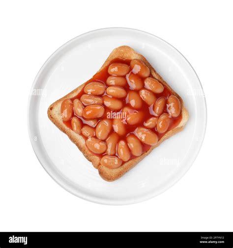 Delicious bread slice with baked beans isolated on white, top view ...