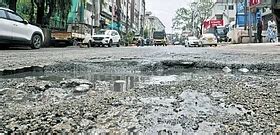 Potholes on service road compound motorists agony amid Saibaba Colony ...