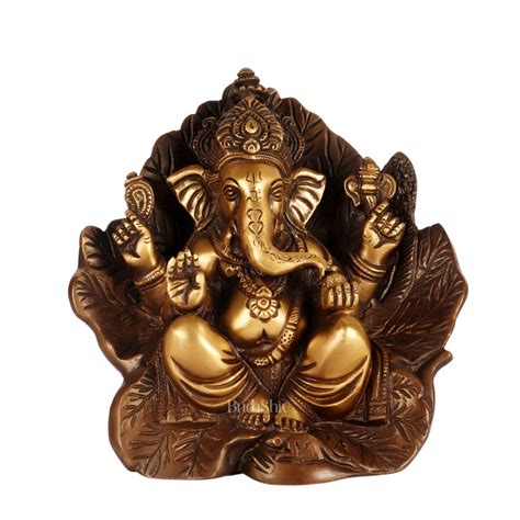Buy Beautifully Handcrafted Brass Ganapathi Statue Seated on Leaf ...