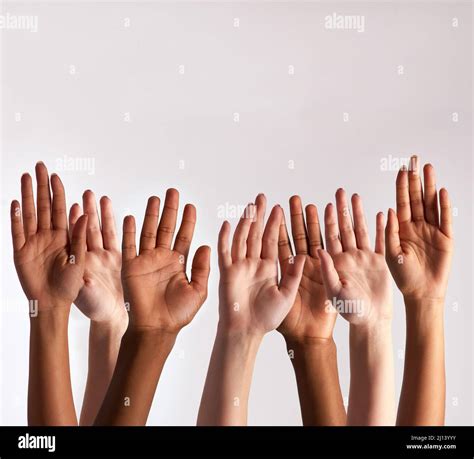 Raise your hands if you support diversity. Cropped shot of a diverse ...