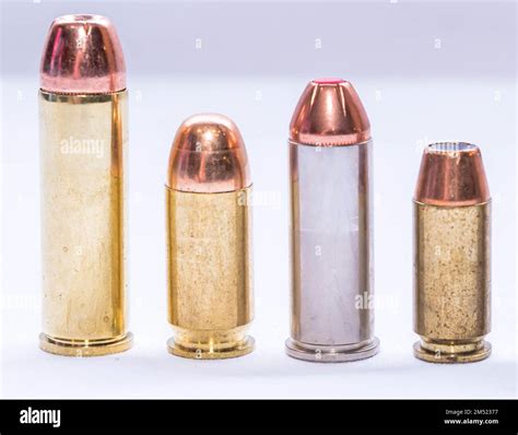 Four different caliber bullets, a 454 casull, 44 special, 45 acp and a ...