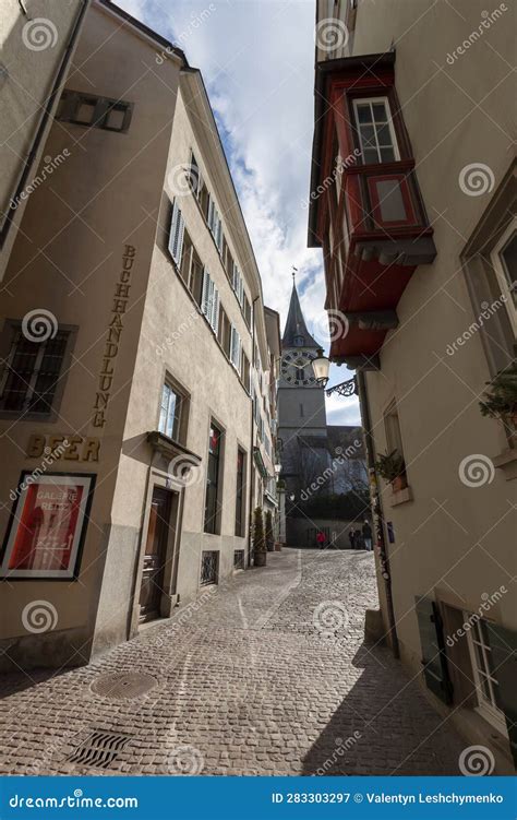 Narrow Street in Old Zurich. in the Distance the Clock Tower of St Editorial Photography - Image ...
