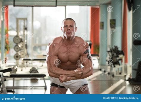 Handsome Body Builder Making Most Muscular Pose Stock Image - Image of ...