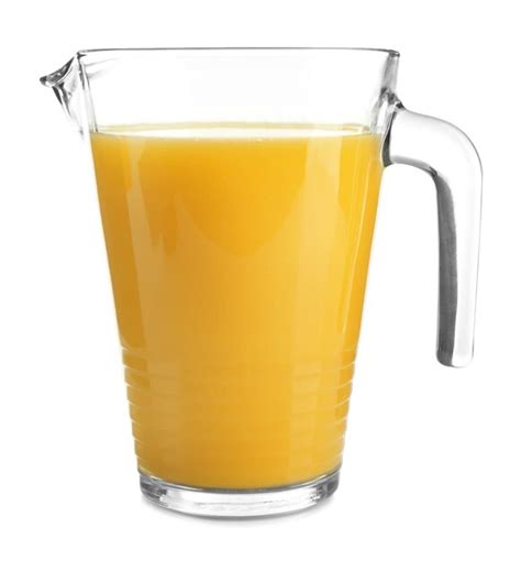 Glass pitcher of fresh orange juice on white background | Premium Photo