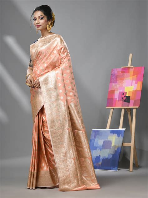 Creamy Peach Katan Silk Banarasi Saree With Ethnic Motifs And Zari Wov ...