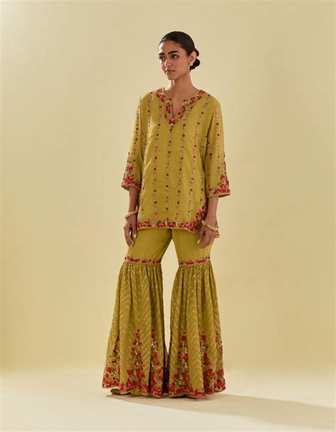 Yellow tissue chanderi short kurta set with round neck and slit in the ...