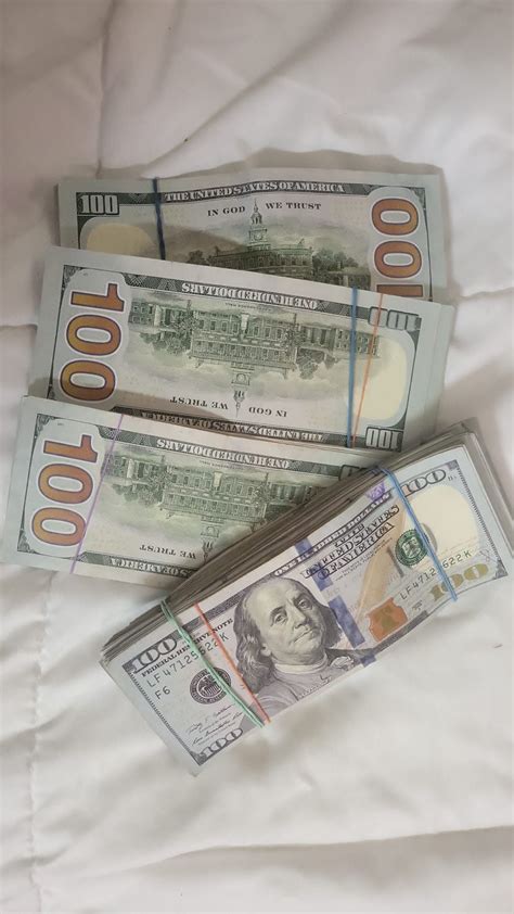 Stacks of Money on Bed