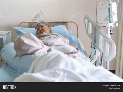 Sick Person In Hospital Bed