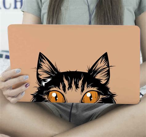 Cat face with orange eyes laptop sticker - TenStickers