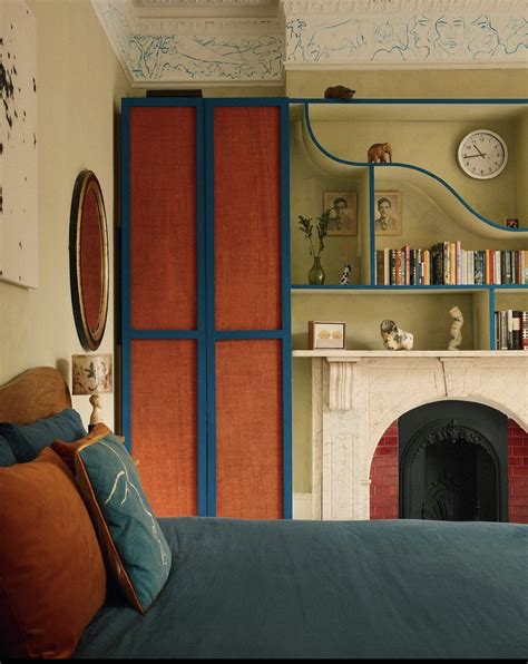 Cozy Bedroom with Fireplace and Bookshelf