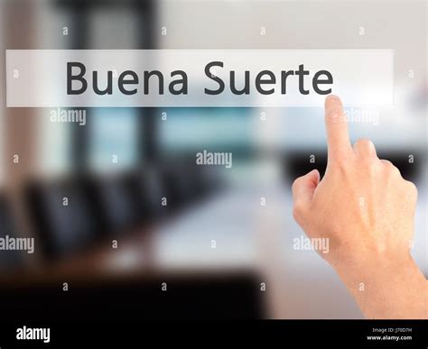 Buena Suerte ( Good Luck in Spanish) - Hand pressing a button on ...