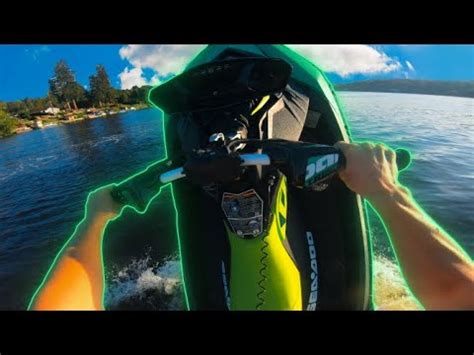 A woman performing a stunt on her Sea-Doo Spark with the words “Make Waves sales event”