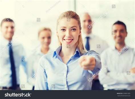 Group of People Standing in Office Pointing 的图像结果