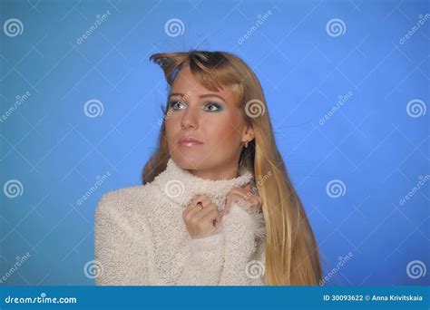 Beautiful Long-haired Blond Woman on a Blue Background Stock Photo ...