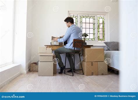 Rear View of Man Running Business from Home Dispatching Goods Stock Photo - Image of twenties ...