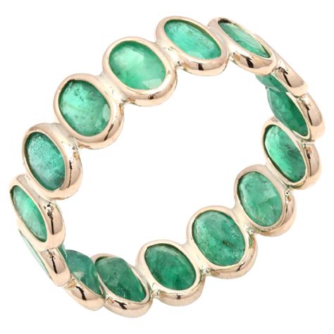 18 Karat Yellow Gold 40 Pointers Oval-Cut Natural Emerald Eternity Band ...