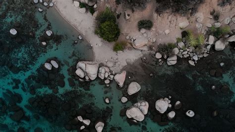 Download wallpaper 1920x1080 stones, water, coast, aerial view full hd ...