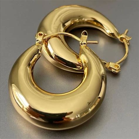 Gold tone chunky hoops. | Chunky hoops, Thick gold hoop earrings ...