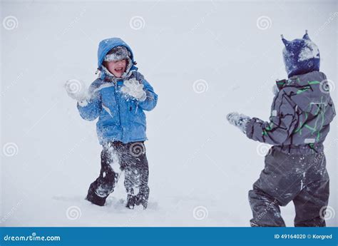 Children play in the snow stock photo. Image of play - 49164020