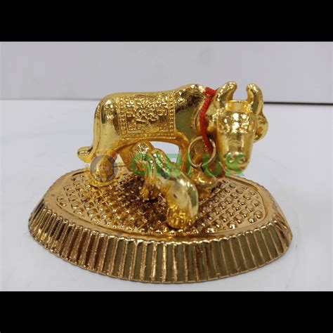 Buy a brass/gold cow and calf piece. Sacred to Hindus.