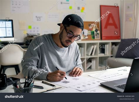 Candid Shot Asian Graphic Designer Inspecting Stock Photo 2485961385 | Shutterstock