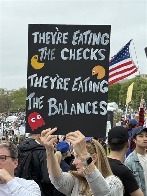 Tax rich, not penguins: Sassy signs at 'Hands Off' protests mock Trump ...