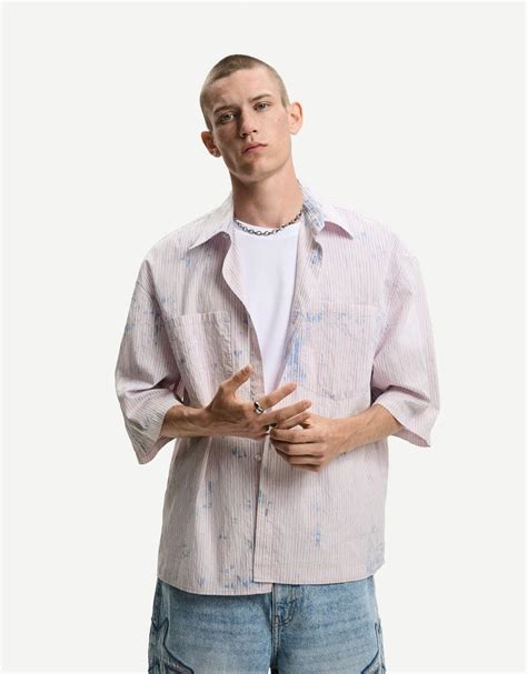 Striped oversize bleached shirt with short sleeves - Men | Bershka