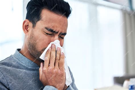 Premium Photo | Blowing nose sick and man with tissue for allergies hayfever and sinus problem ...