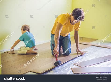 Father Son Installing New Wooden Laminate Stock Photo 683955382 ...