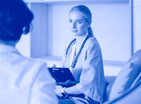 Image of a doctor and a patient reviewing a scan.