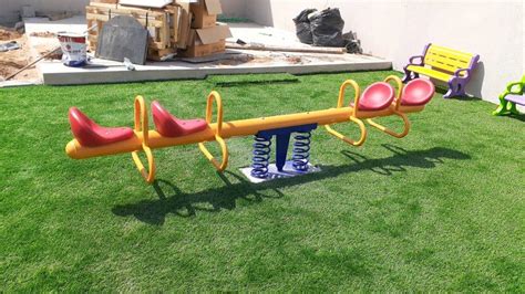 XIANGYU Classic design kid outside play rocking metal four seats garde ...