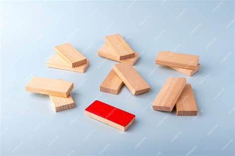 Wooden blocks in pairs and one red as symbol of love couple and single ...