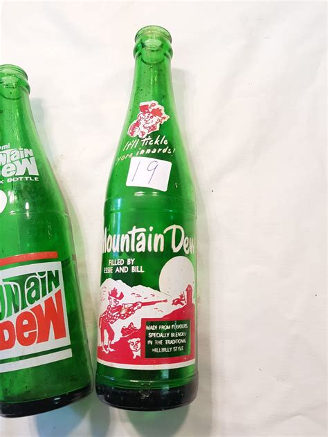 2 Mountain Dew Bottles - Schmalz Auctions