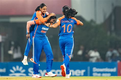 S Sajana is mobbed by her team-mates after accounting for Qiana Joseph ...