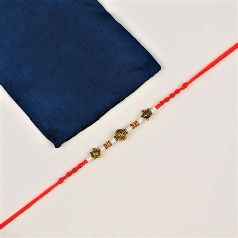 Send Gujarati Style Brass Rakhi Online