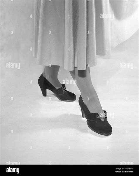 Women's fashion in the 1950s. A woman wearing the shoe fashion of year ...