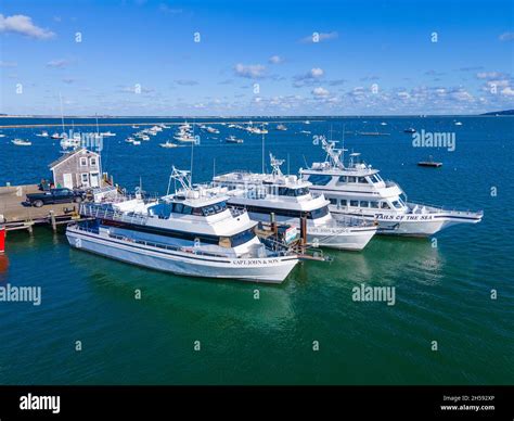 Whale watch ship Capt. John and Son and Tails of the Sea docked at Town ...