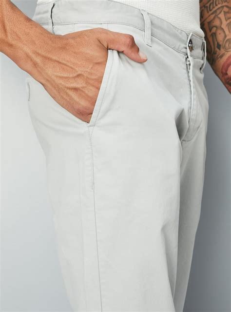 Buy Men Slim Fit Solid Stretch Chinos Online at just Rs. 899.0 ...