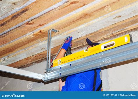 Contractor Installing Garage Door Opener with Metal Frame Holder ...