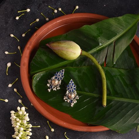 German Silver Dual Tone Earring with Blue Stone and Pearl Detailing ...