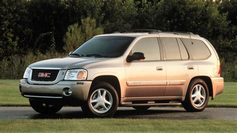Download GMC Envoy SUV on Open Road Wallpaper | Wallpapers.com