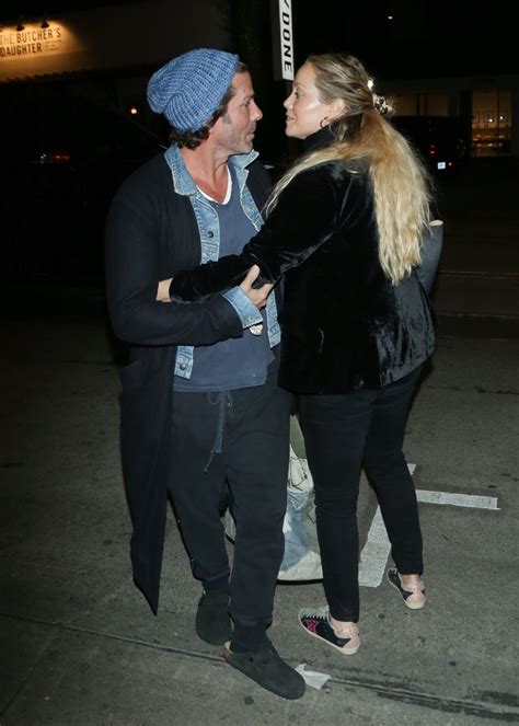 Elizabeth Berkley and Greg Lauren at The Butcher's Daughter in Venice 11/30/2022 • CelebMafia