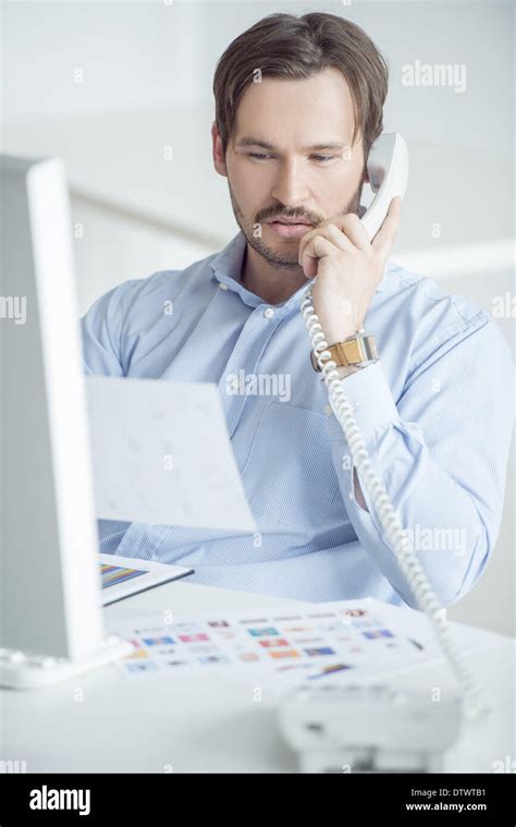 Businessman Working at Desk 的图像结果